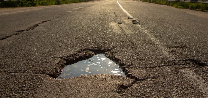 Crack in the road that can cause vehicle damage