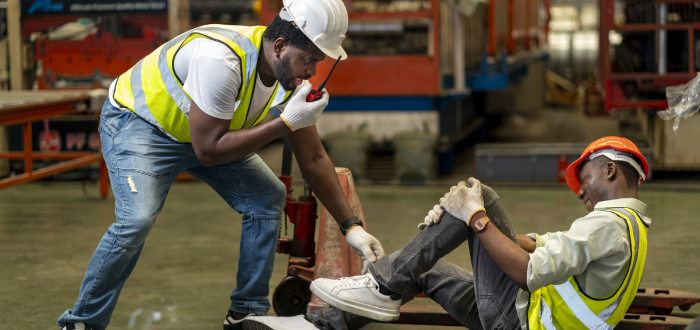 Man falls in the workplace as his coworker calls for help