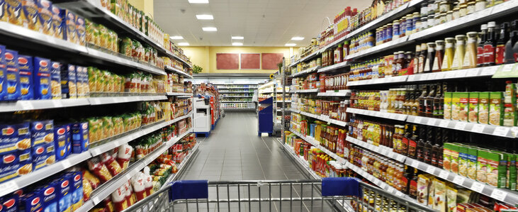 Shopping cart in a supermarket aisle