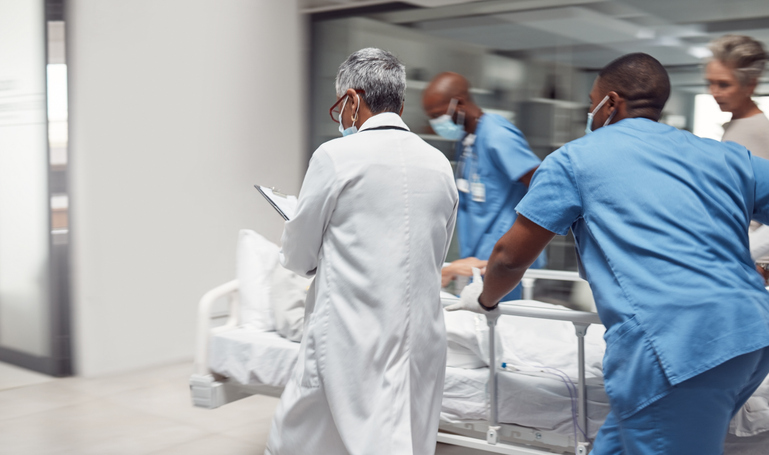 Doctors rushing in the emergency room of a hospital.