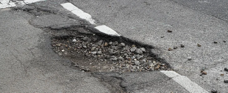 Potholes on a road